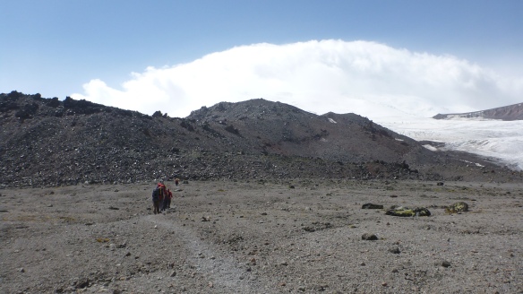 Heading towards the rocks at 3,500m where we would cache our glacier equipment.